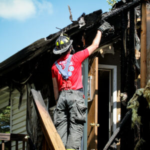 firefighter checking damage