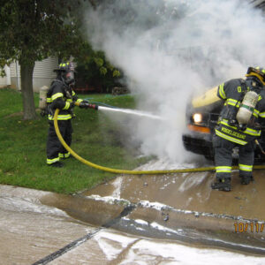 firefighter hosting a vehicle down